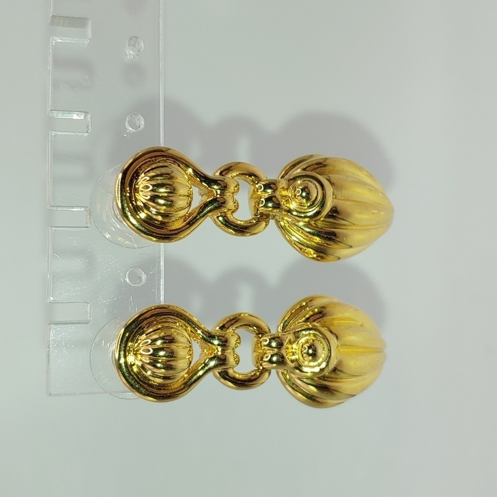 Gold tone pieced earrings.